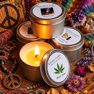 May include: Four round silver metal tins containing Kittredge Candles 100% Pure Soy Candle. One tin is open, revealing a lit yellow candle with a visible flame. Labels feature text including Patchouli, Nag Champa, Sandalwood Vanilla, and Mary Jane.