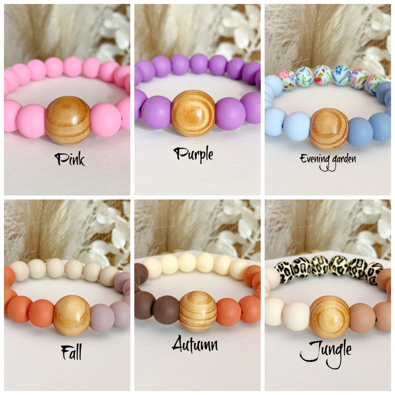 May include: Six silicone bracelets with wooden beads. The bracelets are in different colors and patterns, including pink, purple, blue with floral print, beige, cream with brown beads, and white with black leopard print.