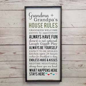 May include: A framed sign with the text "Grandma + Grandpa's House Rules" and a list of rules for grandkids, including "Always have fun", "Expect to be spoiled", and "What happens here stays here".