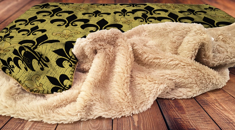 Black and gold fleur de lis family room decor floor mat ottomans and throw blankets and pillows from my art.