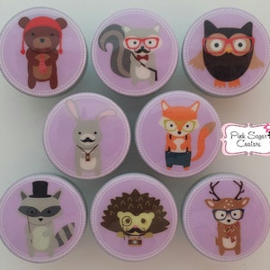 May include: Set of eight purple and gray round knobs with various woodland animal illustrations. Each knob features a different animal wearing glasses and a mustache. The animals include a bear, squirrel, owl, rabbit, fox, raccoon, hedgehog, and deer.