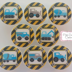May include: Eight round construction vehicle themed stickers with black and yellow striped borders. The stickers feature a variety of construction vehicles including a cement mixer, a tipper truck, a bulldozer, and a digger. The stickers are perfect for adding a fun and playful touch to any project.