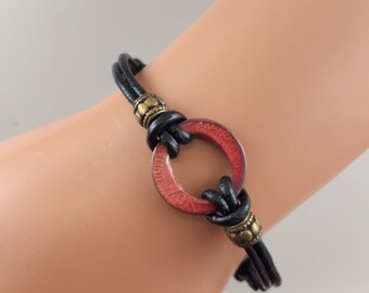 BRACELET,ENAMELED PENNY, 5 to 8 in. Adjustable Knotted Leather Cord, Lead Free Ruby Red Enameled Bracelet, 5 mm Bronze Rondelle beads accent