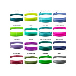 May include: A collection of 12 different colored plastic tubes, each with a unique name. The colors include deep sea, UV yellow, cloudless sky, perfect periwinkle, goblin green, aqua, peacock, furious fuchsia, lavender, purps, teal we meet again, mad hatter, pickled beet, olive branch, UV green, and silver.