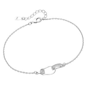 May include: A silver bracelet with a small, diamond-encrusted clasp. The bracelet has a delicate chain design.