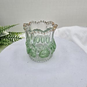 May include: A rustic wooden sign with the text "Welcome to our home" in white lettering. The sign features a distressed finish and a simple, inviting design, perfect for entryway decor.