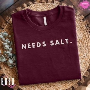 Needs Salt Shirt, Funny Chef T-Shirt, Culinary Apparel for Foodie, Food Lover Gift, Cooking Humor Tee, Kitchen Fashion, Food-Themed Clothing