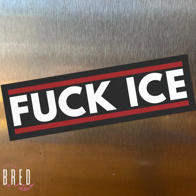 FUCK ICE car magnet flat lay on a neutral surface, minimalist anti ICE political magnet with bold typography.