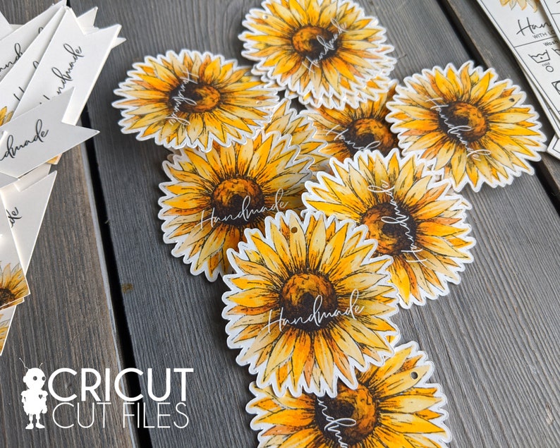 May include: A set of round, white gift tags featuring a watercolour sunflower design. The sunflowers are yellow and orange with brown centres. The tags have the word "Handmade" written in black script.