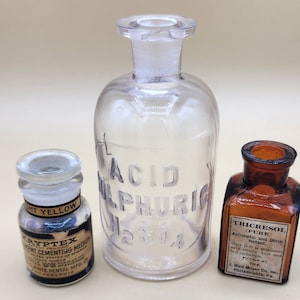 3 mid-century apothecary bottles