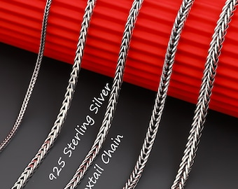 May include: Four silver foxtail chains of varying thicknesses arranged vertically. The metal links feature a woven, braided texture. The text 925 Sterling Silver Foxtail Chain is printed in white on the dark surface between the chains.