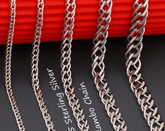 May include: Five silver-toned metal chains of varying thicknesses arranged vertically. Each chain features a repeating interlocking link pattern. The text 925 Sterling Silver Rambo Chain is printed in white between the third and fourth chains.