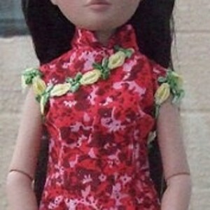 May include: A red and white floral print dress with yellow floral accents. The dress has a mandarin collar and short sleeves.