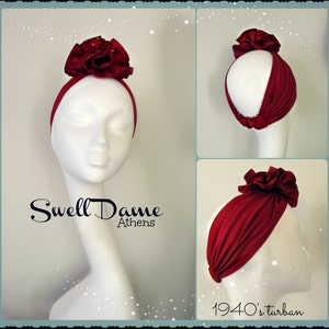 May include: A red turban headband with a large red flower on top. The headband is on a white mannequin head. The text "Swell Dame Athens" is below the mannequin head. The text "1940's turban" is below the headband on the mannequin head.