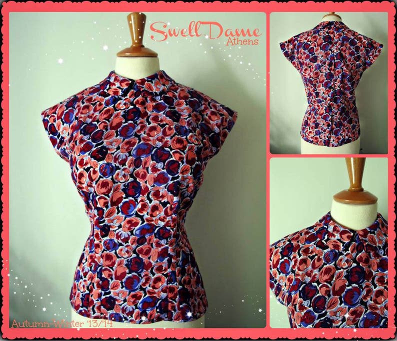 May include: A red, blue, and white floral print blouse with a mandarin collar. The blouse has a fitted bodice and a slightly flared skirt. The text "Swell Dame Athens" is visible in the top right corner of the image.