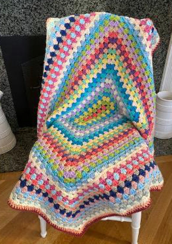 My son's rainbow blanket. Made with Caron Big Cakes, acrylic yarn