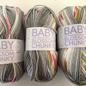 May include: Three balls of gray, white, pink, and green yarn with the label "Baby Blossom Chunky" on each ball.