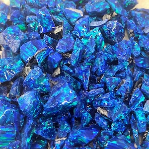 May include: A set of three ceramic mugs with a speckled, matte finish. The mugs are in shades of cream, light gray, and dark gray. Each mug has a simple, minimalist design, perfect for coffee or tea.