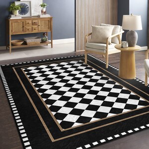 May include: Black and white checkered area rug with a brown border. The rug has a diamond pattern and is surrounded by a black border with a white trim.