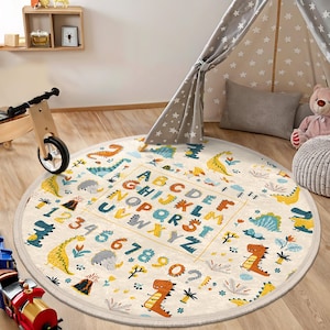 Alfombra redonda con alfabeto de dinosaurios para habitación de niños, alfombra circular con letras y números de dinosaurios, alfombra educativa ovalada con animales, alfombra beige con arcoíris y alfabeto para sala de juegos