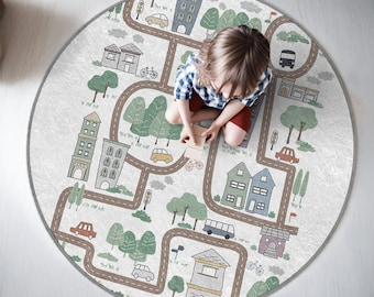 May include: A round, white playmat with a colorful city scene. The playmat features roads, buildings, cars, trees, and a child sitting in the middle. The playmat is perfect for imaginative play and learning.