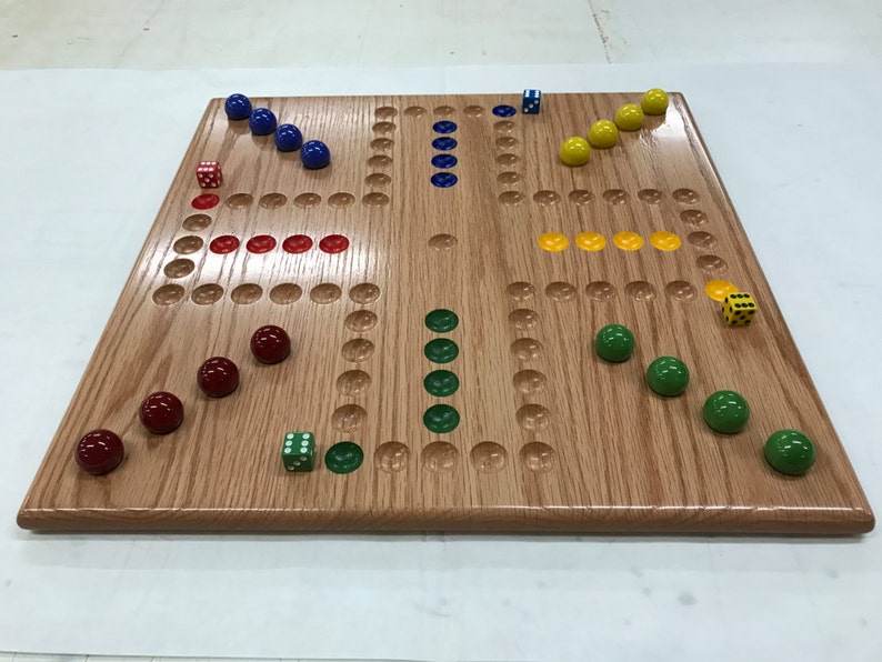round wooden board game with marbles