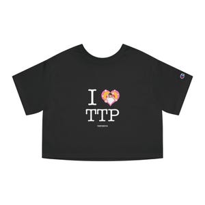May include: Black Champion crop top with the text "I TTP" in white. The "I" is a white letter, and the heart is pink and yellow with a cartoon image. The text "TENTEEPOR" is below the text.