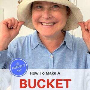 May include: A woman wearing a blue shirt holds up a brown and blue bucket hat with a white brim. The hat has a paisley pattern. The text "the PERFECT FIT" and "How To Make A BUCKET HAT PDF SEWING PATTERN" is displayed below the image.