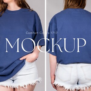 May include: A blue short-sleeved t-shirt with a crew neckline, shown from both the front and back views. The shirt features the text Comfort Colors 1717 and MOCKUP printed in white across the center. The garment is paired with light blue denim shorts.