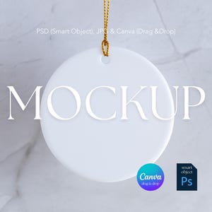 May include: A white, round ceramic ornament with the word "MOCKUP" in large, elegant letters. The ornament hangs from a gold cord. The image also includes the text "PSD (Smart Object), JPG & Canva (Drag & Drop)" and Canva and Photoshop logos.