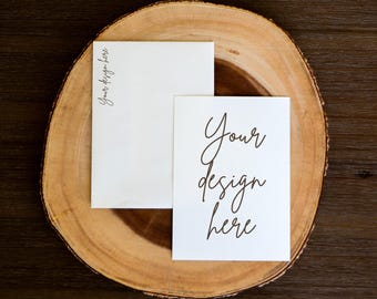 May include: Two blank white cards on a wooden slice. The top card has the text "Your design here" written in cursive. The bottom card has the text "Your design here" written in cursive.