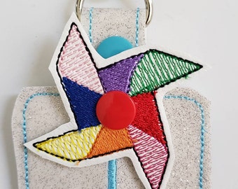 Hand sanitizer holder - glitter vinyl Pinwheel hand sanitizer holder - purse tag - sports bag tag - hand sanitizer fob - back pack tag