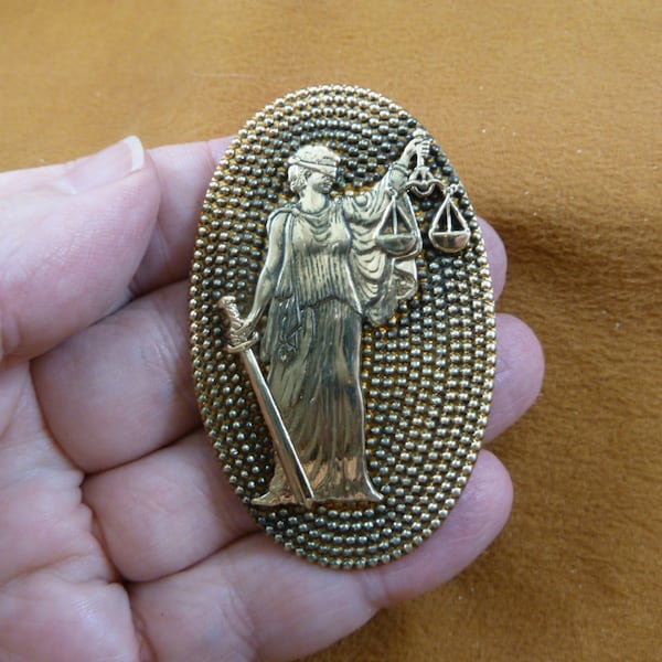 Woman Justice is Blind design on dot textured oval repro Victorian brass pin pendant B-OTHER-14-5