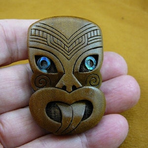 traditional tribal Maori mask carved Kauri wood face with blue green black paua sea shell abalone eye pin pendant New Zealand j470-8