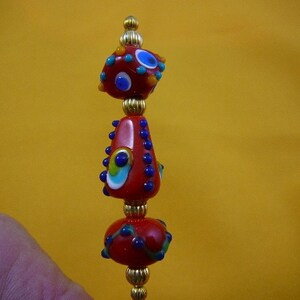 Red with blue dot striped design glass 3 beaded gold tone bead hatpin ladies pin for hat U288-2
