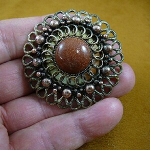 Orange Goldstone with on scrolled round looped Victorian repro brass pin pendant BB310-3