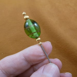 one clear green oval glass bead with copper striping gold tone beads hatpin ladies pin hat I love hatpins accessory U283-82