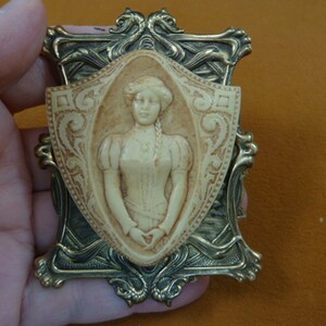 Victorian Woman on scrolled shield with braid ivory tan Cameo brass pin pendant brooch CL28-9
