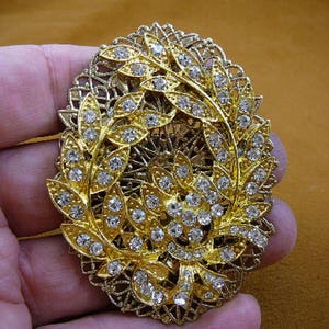 white rhinestone flower bouquet big leaf filigree scrolled oval gold tone brass brooch pin pendant BB601-151