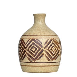 May include: A beige ceramic vase with a rounded body and a narrow neck. The vase is decorated with a repeating pattern of brown diamond shapes and horizontal brown bands. The vase has a textured surface.