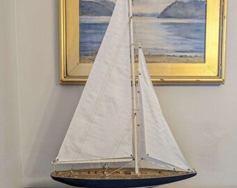 Vintage large wooden sailboat magnificent sails