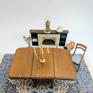 Drop leaf table with brass hinges Sonia Messer