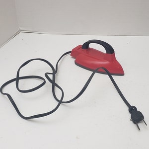 Vintage Toy Red electric  Iron lights up with original cord.