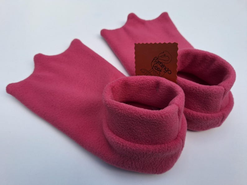 May include: A set of three ceramic mugs with a speckled, matte finish. The mugs are in shades of cream, light gray, and dark gray. Each mug has a simple, minimalist design, perfect for coffee or tea.