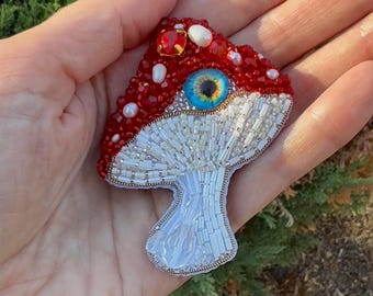 Beaded Mushroom brooch with evil eye, Surreal Fly Agaric Pin, Unique Amanita Jewelry, Fairytale Cottagecore Badge, Handmade Forest Art Gift