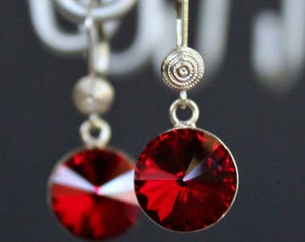 Red Swarovski Crystals Set in a Sterling Silver Bezels that Dangle from a Beautifully Detailed Sterling Silver Earrings