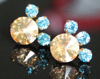 Swarovski Crystal Golden Shadow Rivoli with Three Adjacent Aquamarine Crystals Set in Gold on Gold Stud Earrings