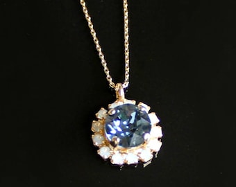 Sapphire Blue Swarovski Crystal  Surrounded By White Opal Halo Crystals Set in a Gold Pendant on a Gold Necklace