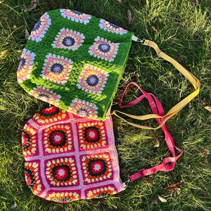 colorful granny square crossbody bag,handmade crochet shoulder bag adjustable,vintage circular flower bag leather strap,boho crossbody bag lined,retro granny square purse handmade,adjustable leather strap shoulder bag,festival crossbody bag colorful,lined crochet bag secure closure,gift for her crossbody bag,vintage style shoulder bag handmade,bright granny square bag,hands free crossbody crochet,travel bag adjustable strap,unique handmade purse granny square,sustainable fashion crossbody bag