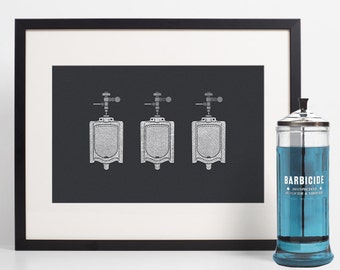 May include: A framed print featuring a detailed, white line drawing of three urinals against a dark gray background. Beside the print is a glass jar with blue liquid and the word "BARBICIDE" in white.